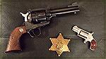 Even the Chief Brothel Inspector needs a Backup. 
Ruger New Blackhawk Convertible 45 ACP / 45 Colt
NAA Mini .22LR