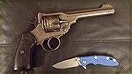 A Webley MK VI with a shaved cylinder to .45 ACP.
Accompanying this is a Rick Hinderer XM-18 knife.