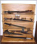 Here is my new bayonet display case.  Solid oak, glass shelves, with a plexiglass cover to keep out dust (not shown).  See the next image, "Bayonet Display II," for descriptions of the content.