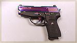 This is a SIG Sauer P239 in the Rainbow Finish. Very Striking. 