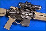 Colt AR with Ultradot Match Dot sight.