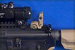 This Magpul adjustable rear peep sight pops up when needed and includes a small aperture for longer range and a large, ghost-ring sized aperture for close range.