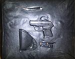 Just one example of a Micro Gun. This is the Ruger LCP chambered in .380 ACP. The holster is the DeSantis nemesis. There is also a spare magazine. 