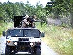 USAF HumVee possibly on a training mission based on foliage in photo, and woodland uniform on the trooper behind the staff sergeant firing the M60.