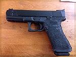 Swenson Glock 17 aftermarket slide on heavily stippled Glock 17