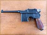 Just picked up a "Red 9" Mauser C96 at a local VGCA gun show. 
It is chambered in the standard 9x19 parabellum round, consistent with the red 9 carved into the grip panels. 50-500 meter tangent sight