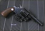 Colt Official Police with 4" barrel, caliber .38 Special.  Made in 1943.