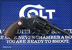 Colt Official Police with 4" barrel, caliber .38 Special.  Made in 1943.