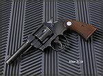 Colt Official Police with 4" barrel, caliber .38 Special.  Made in 1943.