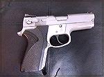 The 6906 is a third-generation version of the S&W 69 series, which were compact 9mm pistols with double-column magazines of 10 or 12 rounds. The 69-series pistols were designed to be small enough for 