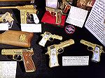 Gold Damascened Spanish handguns seen in a collection displayed in the NRA Collectors area at the 2019 NRA Annual Meetings & Trade Show. Visible are an Astra M902, an Astra A-60, a Llama Omni, and a s