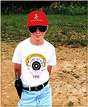 My son Eric in about 1994 with hs Brazilian contract M1917 Second Model Hand Ejector in.45ACP holstered at his hip.  A happy eleven-year-old.