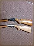 These are the classic Browning SA 22 that load through the stock. The lighter colored stock was made in Japan and the slightly darker stock was made in Belgium.