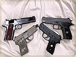Some of my pistols wearing G10 grips