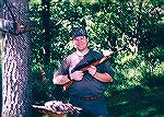 Photo from a couple of centuries back. Kim and I had just come back from squirrel hunting near his home in western Missouri.  Rifle was my old Ruger 10-22 with a Bushnell 1.5x-4.5x.  My son has owned 