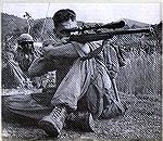 Marine sniper in Vietnam with Winchester M70 heavy barrel rifle and Unertl 8X scope.
