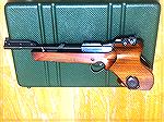 Walther FP electronic free pistol
A beautiful, extremely accurate free pistol. 
Only produced for a few years due to circuit board failure, possibly shorted out by the loading lever rubbing the wiri