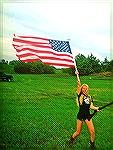 Girl with Rifle in field waving US Flag