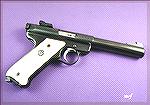 Ruger Mk.II .22 pistol in blue with the five and half inch bull barrel.  Stocks are aftemarket ivory polymer with Ruger emblem.

(Photo by Mark Eric Freburg, copyright 2000, all rights reserved.)