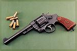 Smith & Wesson 2nd Model Hand Ejector caliber .44 S&W Special.  6.5" barrel, adjustable target sights, built in 1927.  I''ve had it since 1989.  Best group I''ve ever fired with a handgun came from th
